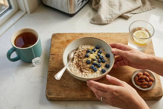 Overhead breakfast scene with oats flaxseed brewer's yeast almonds and lactation tea on kitchen counter