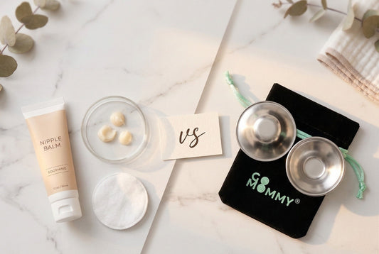 Flat lay comparison of nipple cream tube and cotton pad versus silver nursing cups on their mint velvet pouch 